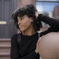 woman wearing long sleeve cotton black top